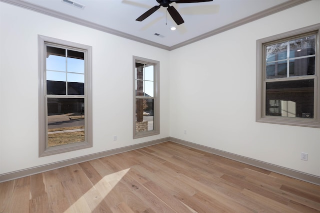 empty room with crown molding, ceiling fan, and light hardwood / wood-style floors