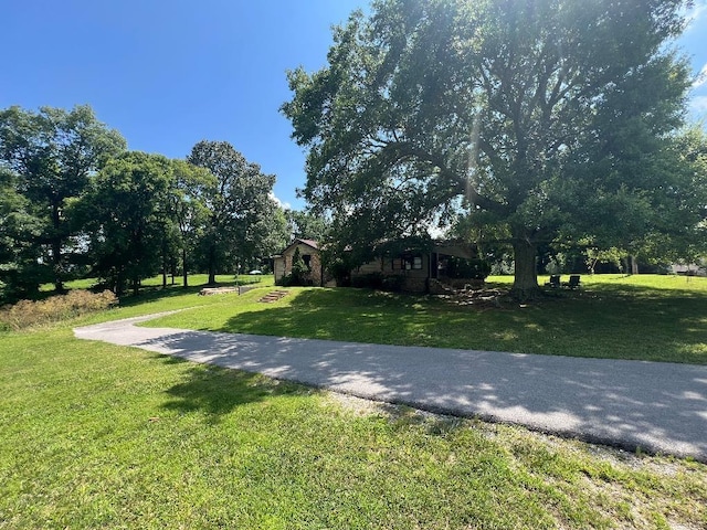  - view of property's community with a lawn