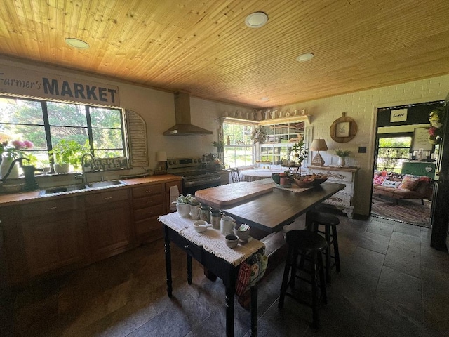 - dining space featuring wood ceiling and recessed lighting