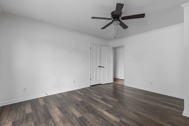  - empty room featuring dark wood-type flooring, baseboards, a ceiling fan, and crown molding