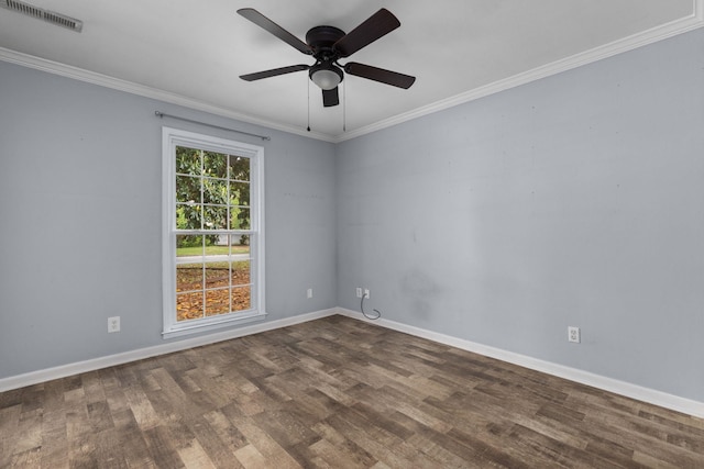  - empty room with dark wood-style floors, crown molding, a ceiling fan, and baseboards