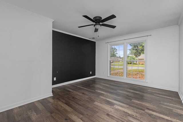  - empty room featuring crown molding, dark wood-style floors, baseboards, and ceiling fan