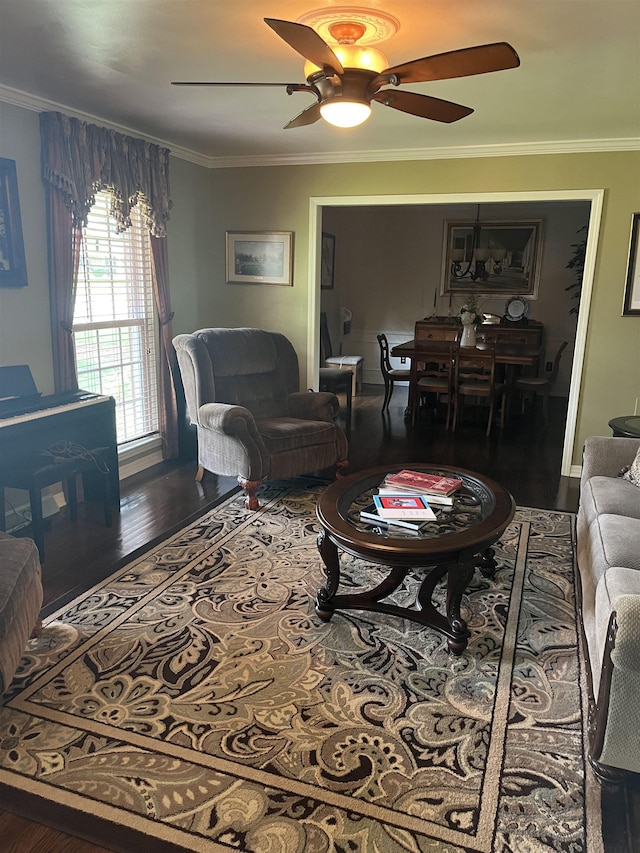  - living room with ceiling fan, crown molding, and wood finished floors