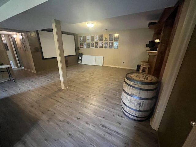  - finished below grade area with wood finished floors and baseboards