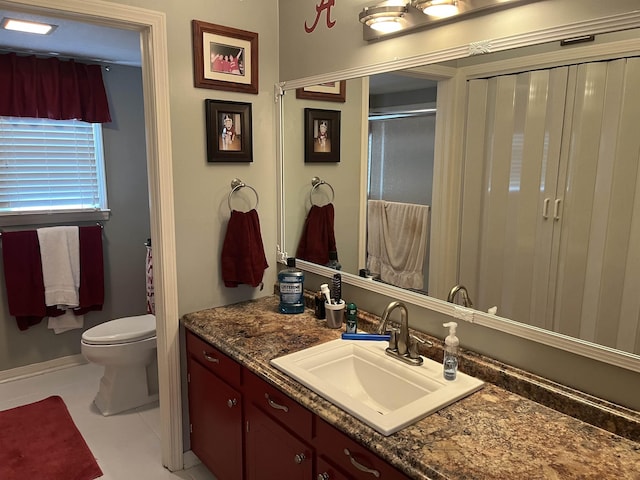  - full bathroom featuring vanity, toilet, and a shower with shower door