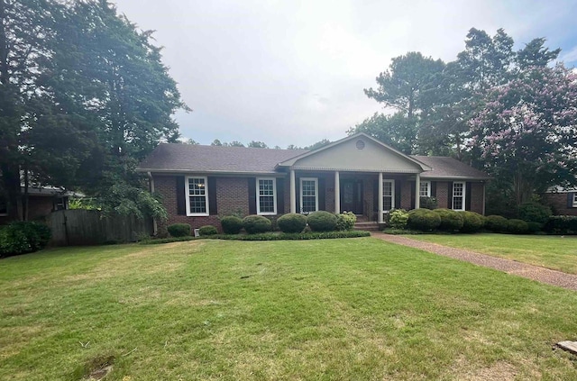  - ranch-style home with brick siding and a porch