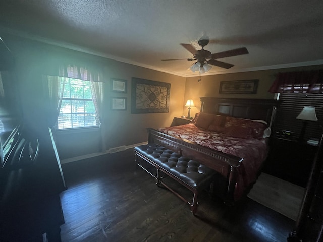  - bedroom featuring wood finished floors, ornamental molding, baseboards, ceiling fan, and a textured ceiling