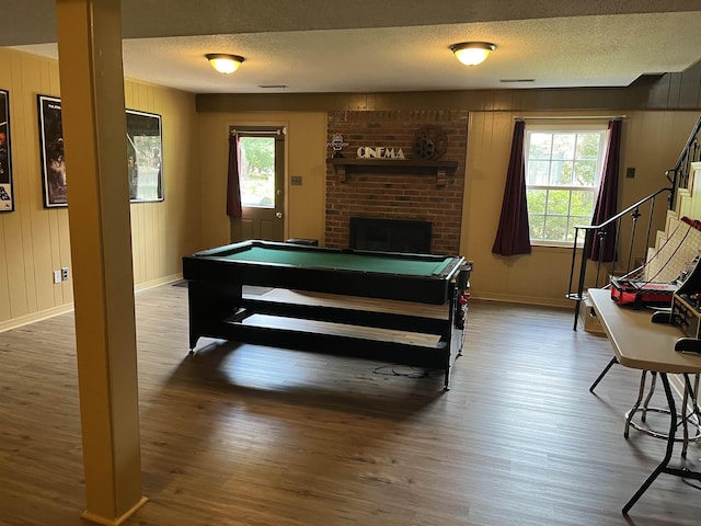  - rec room featuring wood finished floors, pool table, plenty of natural light, baseboards, and a textured ceiling