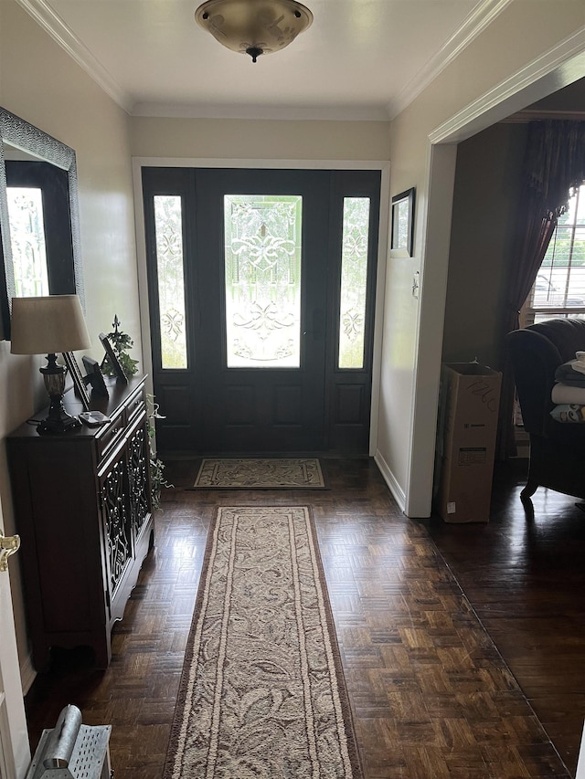  - foyer entrance featuring ornamental molding and baseboards