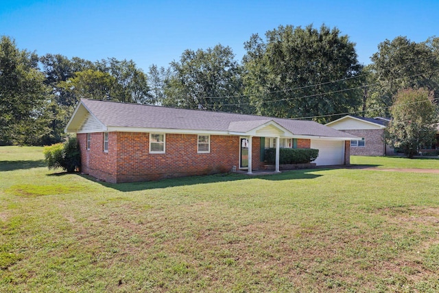 ranch-style house featuring a garage and a front yard