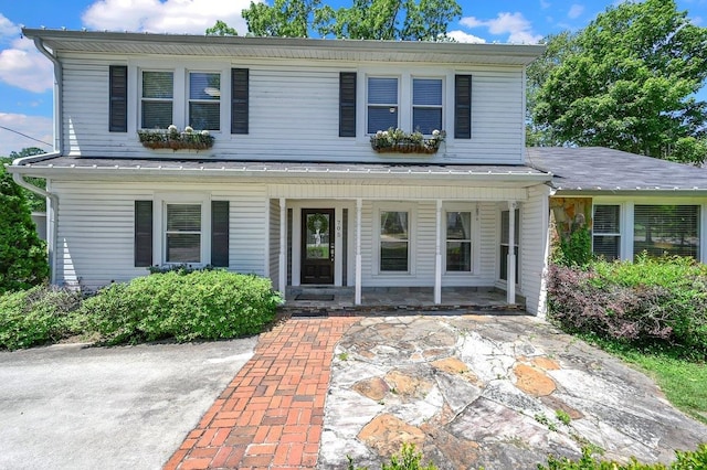  - traditional home with a porch