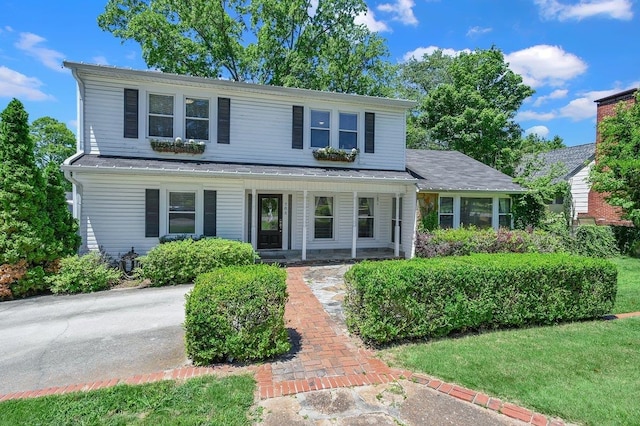  - traditional-style home featuring a porch