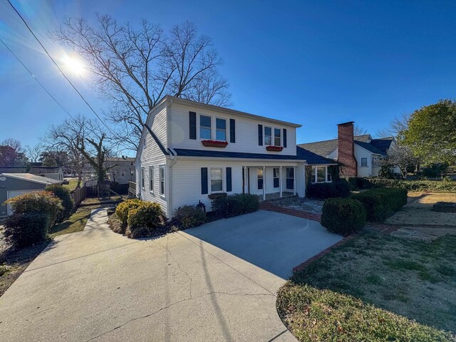  - traditional home with concrete driveway