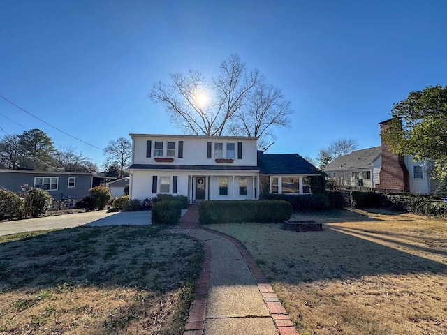  - traditional-style home featuring a front lawn