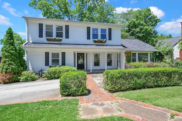  - traditional-style home with a porch