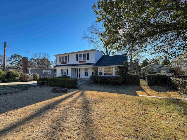 - traditional home with a front yard
