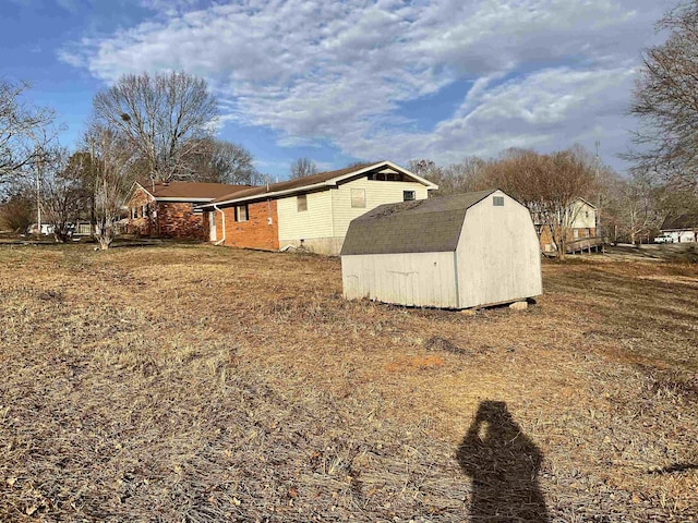 view of home's exterior with a shed