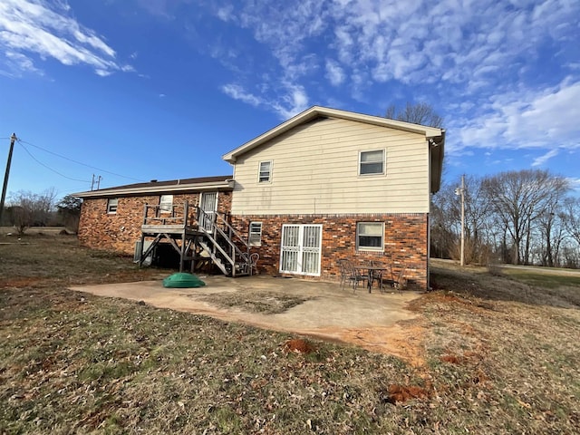 back of property featuring a patio area