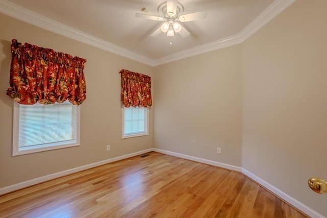 empty room featuring ceiling fan, light hardwood / wood-style flooring, and ornamental molding