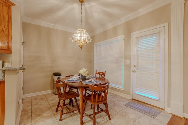 dining area featuring light tile patterned floors, crown molding, and a notable chandelier