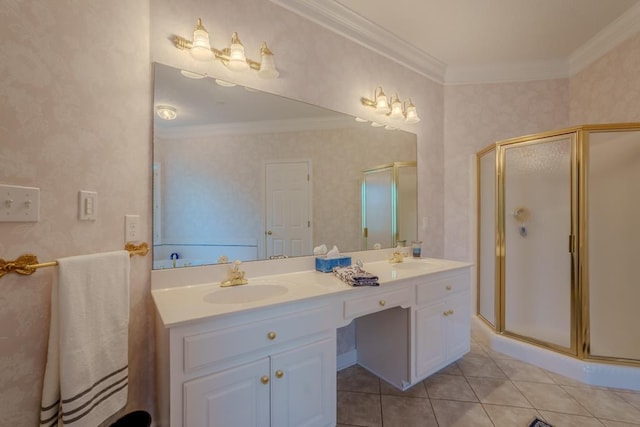 bathroom with tile patterned flooring, vanity, a shower with door, and crown molding