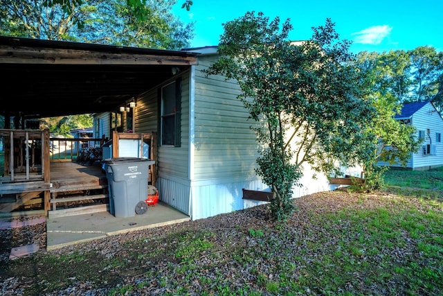 view of home's exterior with a wooden deck