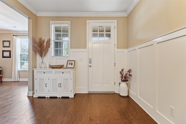 foyer with crown molding and dark hardwood / wood-style floors