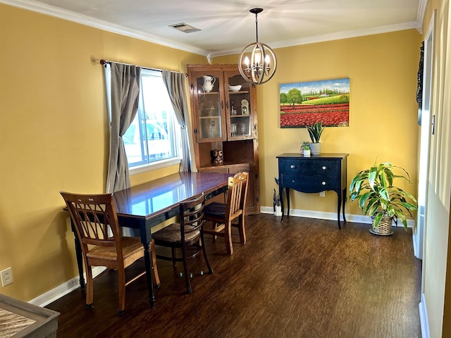 dining room with crown molding, a notable chandelier, visible vents, and dark wood-style flooring