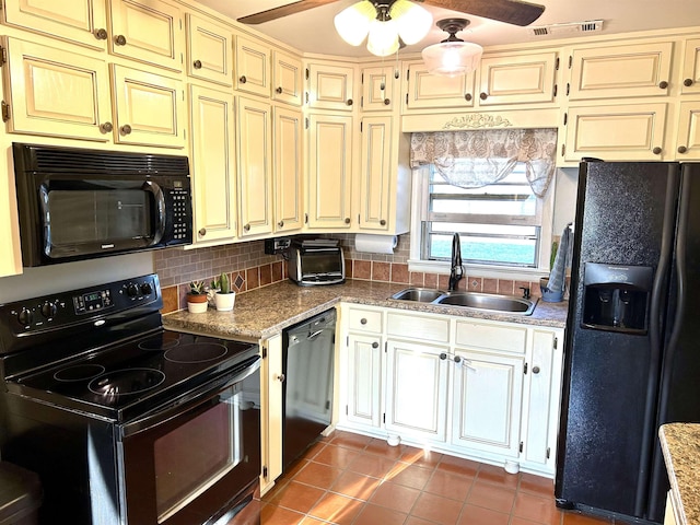 kitchen featuring a sink, cream cabinetry, black appliances, and ceiling fan