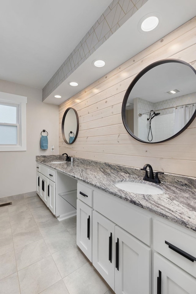 bathroom featuring vanity, tile patterned floors, and a shower with shower curtain