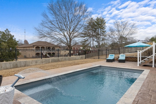 view of swimming pool featuring a patio