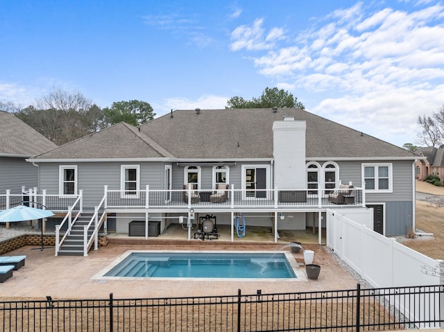 view of pool featuring a patio and a deck