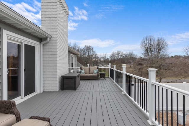 wooden deck featuring outdoor lounge area