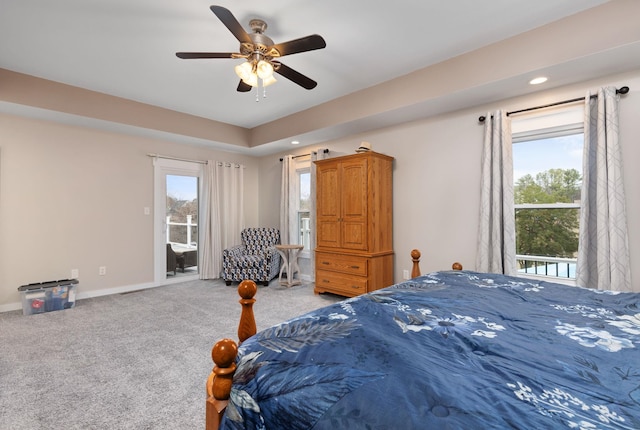 bedroom with multiple windows, carpet, access to exterior, and ceiling fan