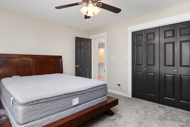 carpeted bedroom featuring ceiling fan and a closet