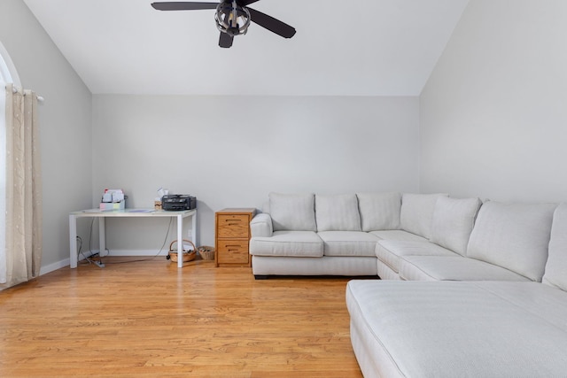 living room with ceiling fan and light hardwood / wood-style floors