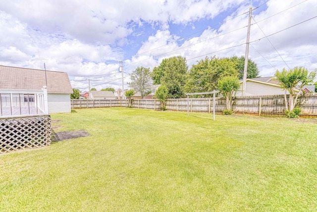 view of yard with a wooden deck