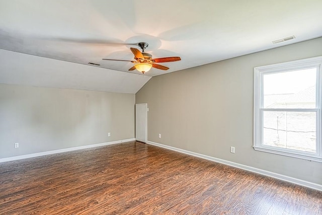 interior space featuring ceiling fan, dark hardwood / wood-style flooring, and lofted ceiling