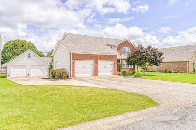 view of front facade with a garage and a front lawn