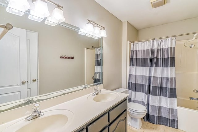 full bathroom with tile patterned floors, shower / tub combo with curtain, vanity, and toilet