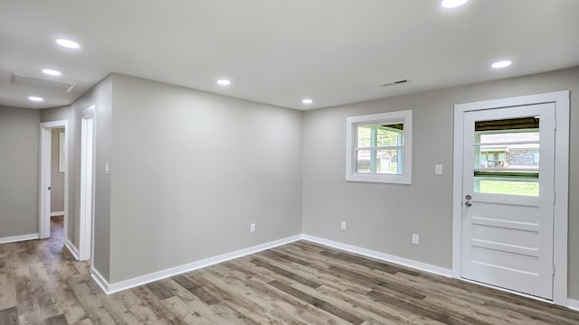 entrance foyer with recessed lighting, visible vents, baseboards, and wood finished floors