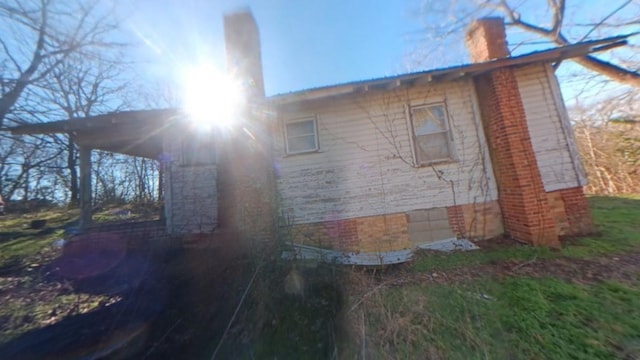 view of home's exterior with a chimney