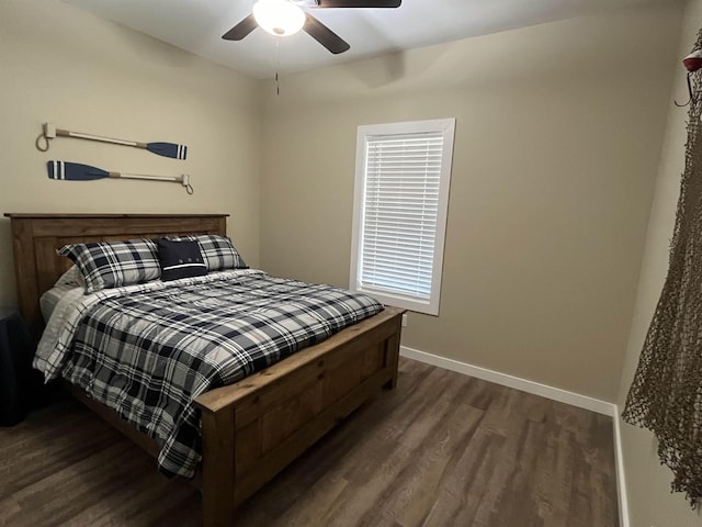 bedroom featuring dark wood-type flooring and ceiling fan