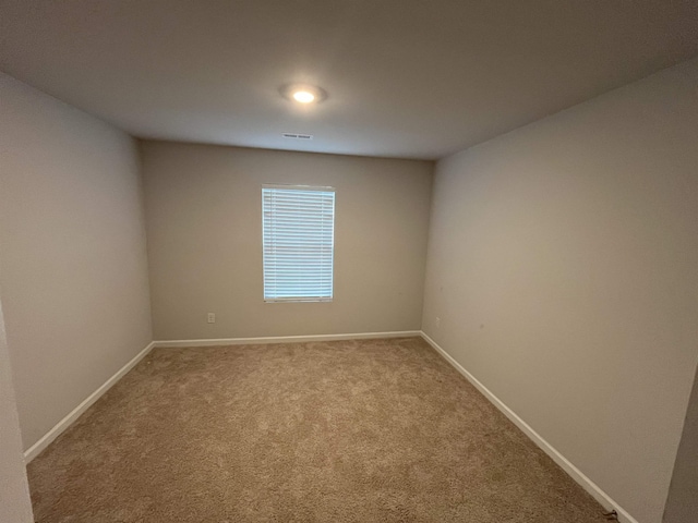 empty room featuring carpet floors