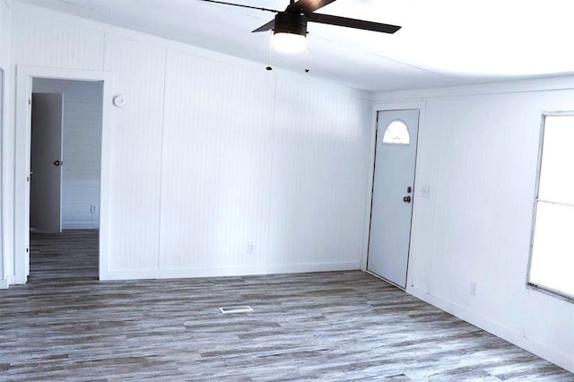 interior space with ceiling fan and wood-type flooring