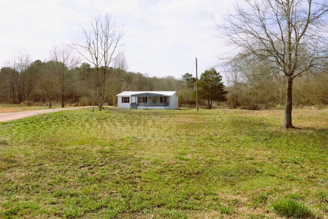 view of yard featuring covered porch