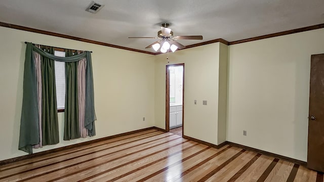 clothes washing area with cabinets, ornamental molding, a textured ceiling, water heater, and washer / clothes dryer