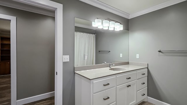 bathroom with vanity and ornamental molding