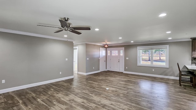 kitchen featuring dark brown cabinetry, electric range, a kitchen breakfast bar, crown molding, and decorative light fixtures