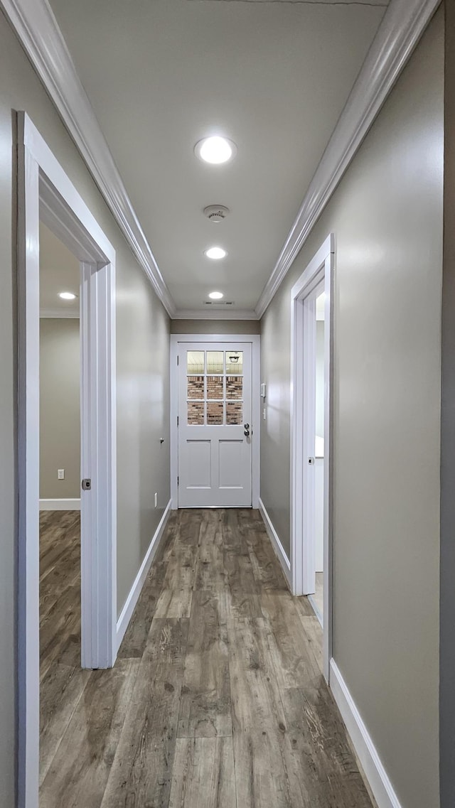 foyer with hardwood / wood-style floors and ornamental molding